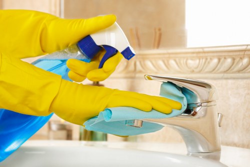 Trained carpet cleaner using protective gear during service