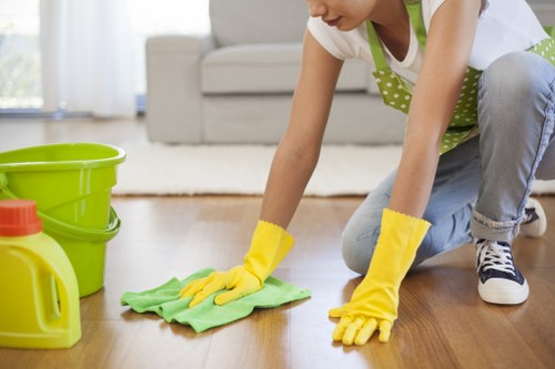 NW1 office cleaning team sanitising a modern workspace