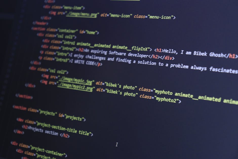 Close-up image of a computer screen displaying a coding interface with HTML and CSS code, featuring colorful tags and text, set against a dark background. The code includes image source links and clas